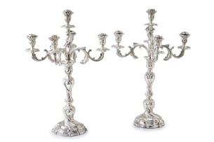 A pair of German silver five-light candelabra,