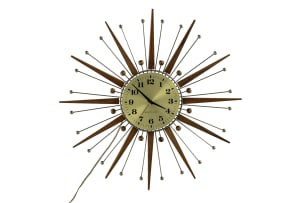 Westclox; Electric atomic-style teak and metal 'Sunburst' wall clock, Scotland