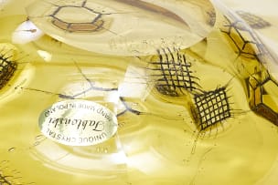 Adam Jablonski; An amber lead crystal bowl with embedded metal mesh