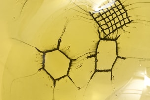 Adam Jablonski; An amber lead crystal bowl with embedded metal mesh