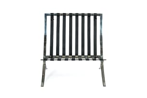 Ludwig Mies van der Rohe; Pair of black leather and chrome 'Barcelona' chairs, after a design in 1929 by Ludwig Mies van der Rohe, Italy