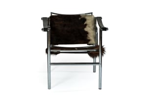 Le Corbusier, Pierre Jeanneret & Charlotte Perriand; Pair of 'LC1' cowhide, leather and chrome armchairs after a 1928 design by Le Corbusier, Pierre Jeannert and Charlotte Periand, Italy