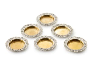Six silver-plated coasters, late 19th/early 20th century