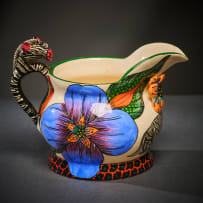 Ardmore Ceramic Studio; Zebra milk jug with blue flowers
