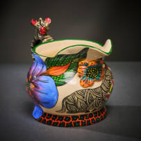 Ardmore Ceramic Studio; Zebra milk jug with blue flowers
