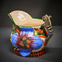 Ardmore Ceramic Studio; Zebra milk jug with blue flowers