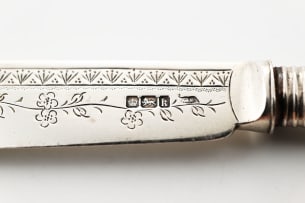 A set of twelve Edward VII silver and mother-of-pearl fish knives and forks, Walker & Hall, Sheffield, 1902