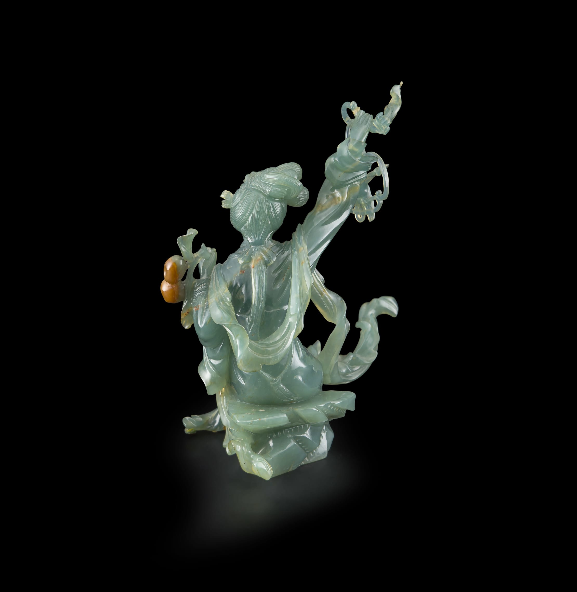 A Chinese carved jade figurine, Qing Dynasty, 20th century Strauss & Co